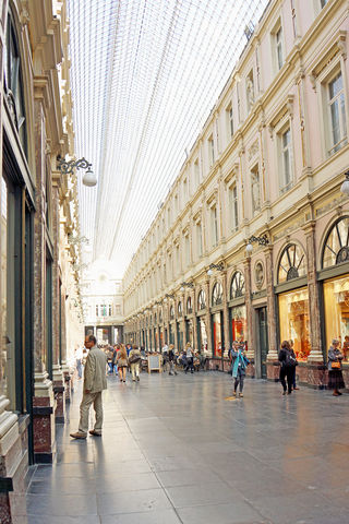 Galeries Royales Saint-Hubert is a shopping arcade with a long covered ceiling.